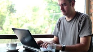 stock-footage-man-typing-on-laptop